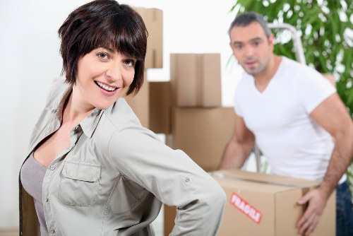 Experienced movers handling office relocation equipment